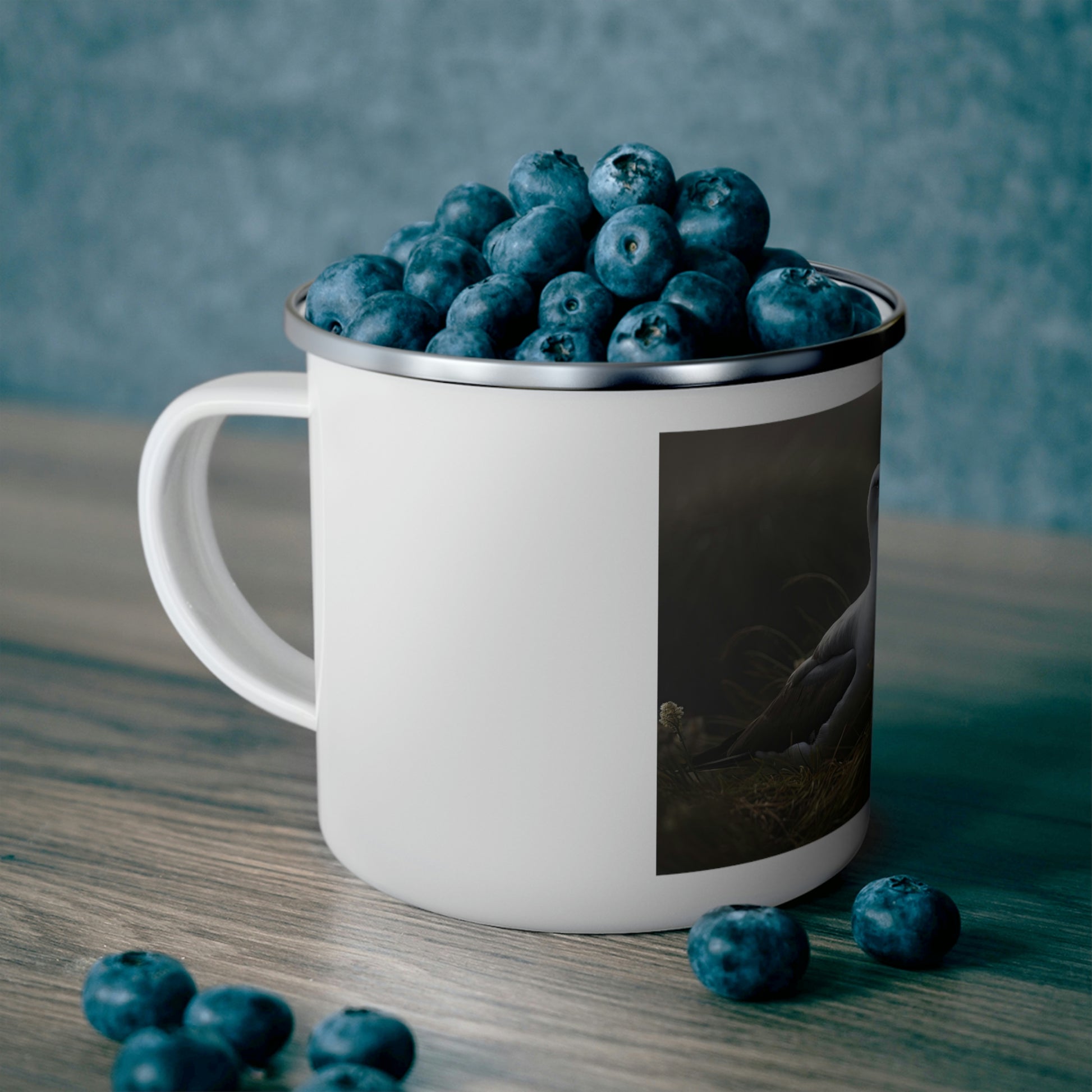 albatross camping mug filled with blueberries