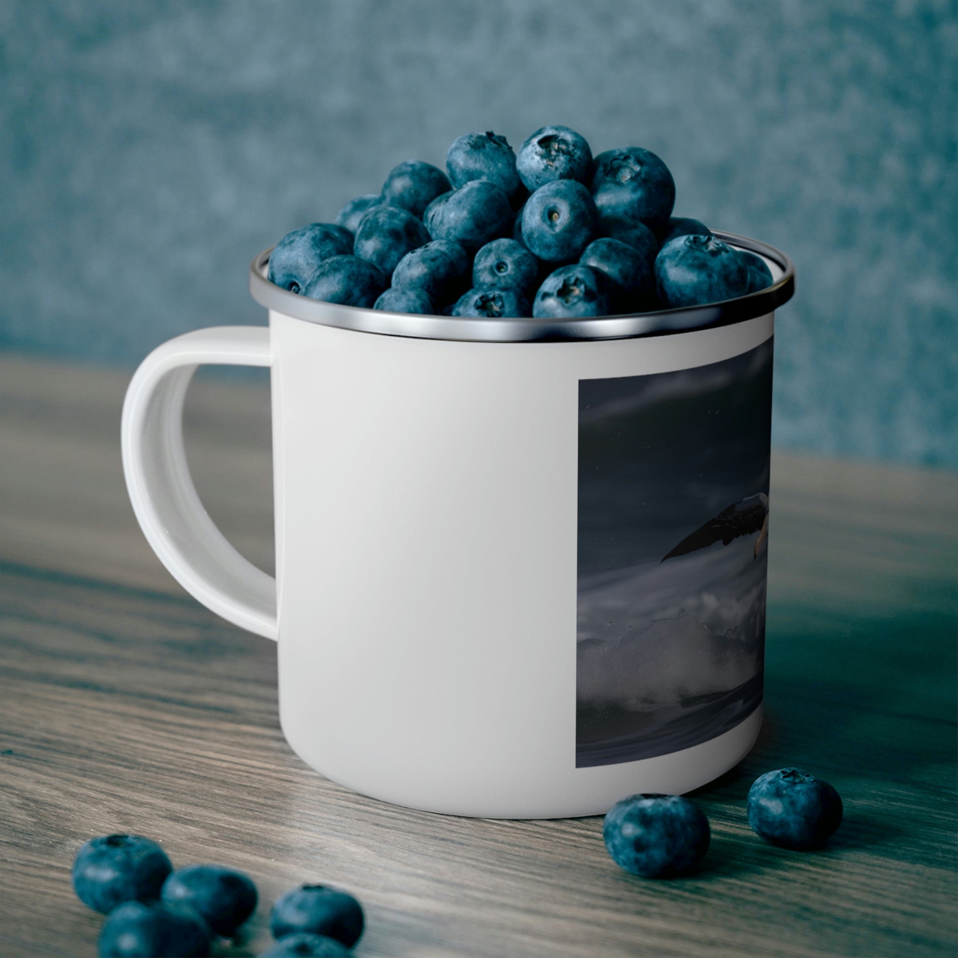 enamel camping cup filled with blueberries